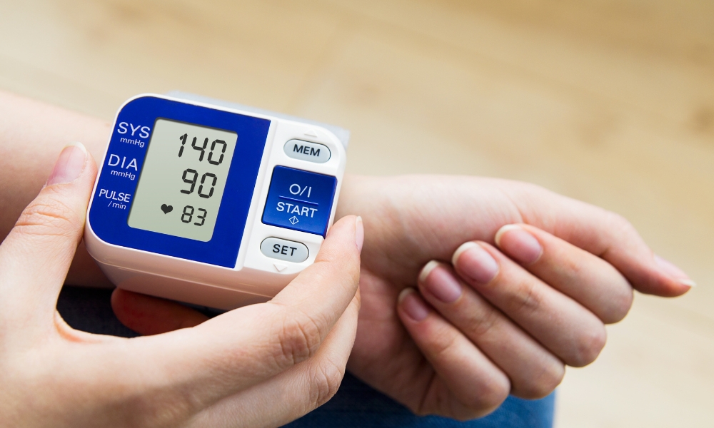 Doctor explaining systolic and diastolic blood pressure readings to a patient in Longview TX