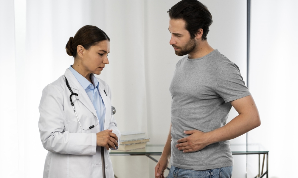 Patient experiencing stomach pain while consulting a primary care provider in Longview TX