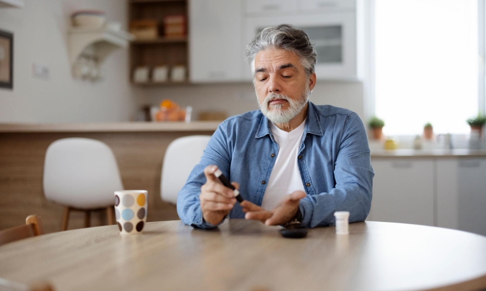 Patient checking blood sugar levels during routine diabetes management appointment