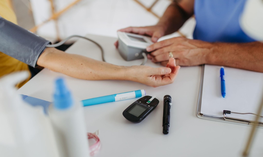Primary care provider discussing Type 2 diabetes management with an adult patient in Longview TX